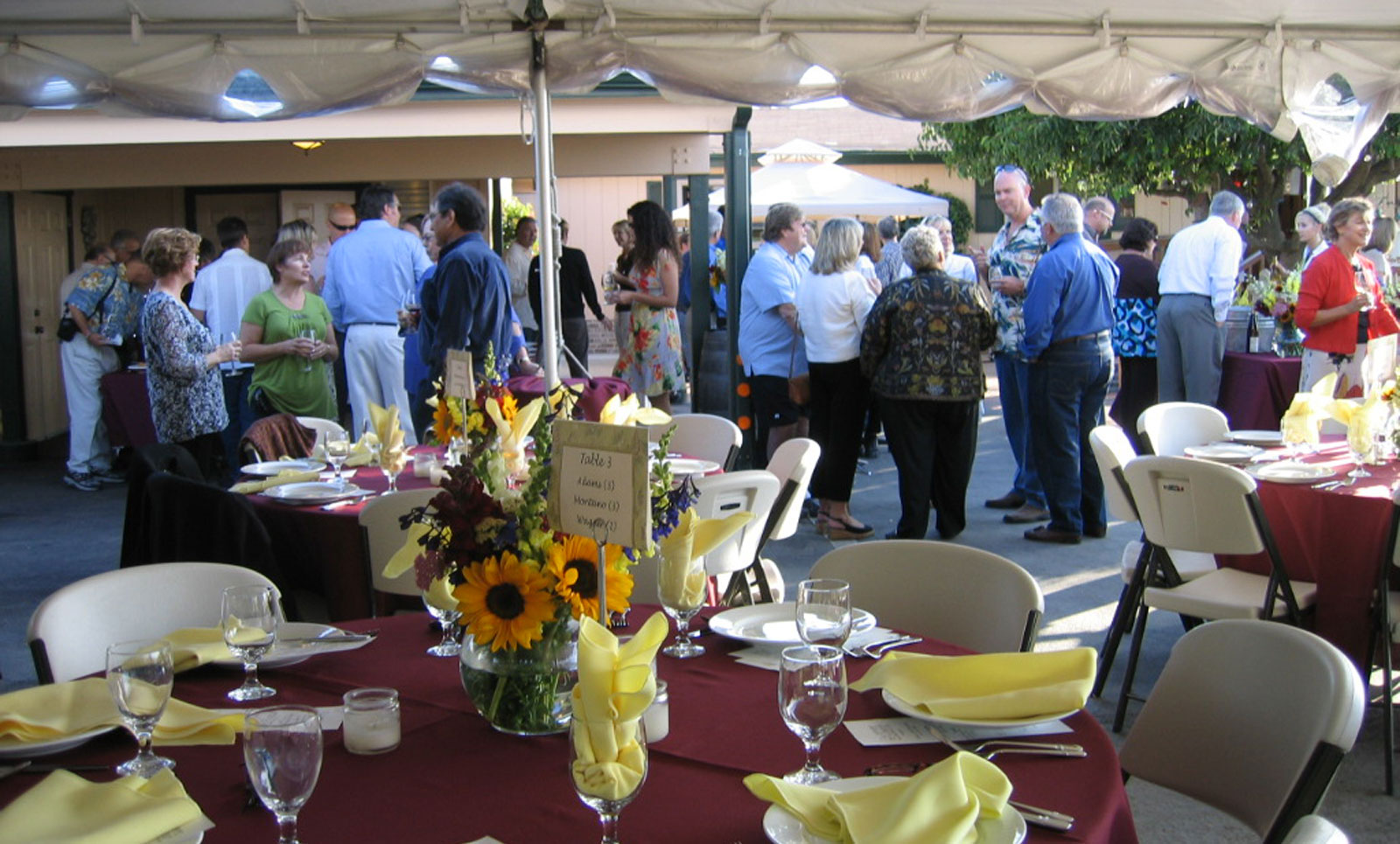 special event under a tent tables set in the foreground